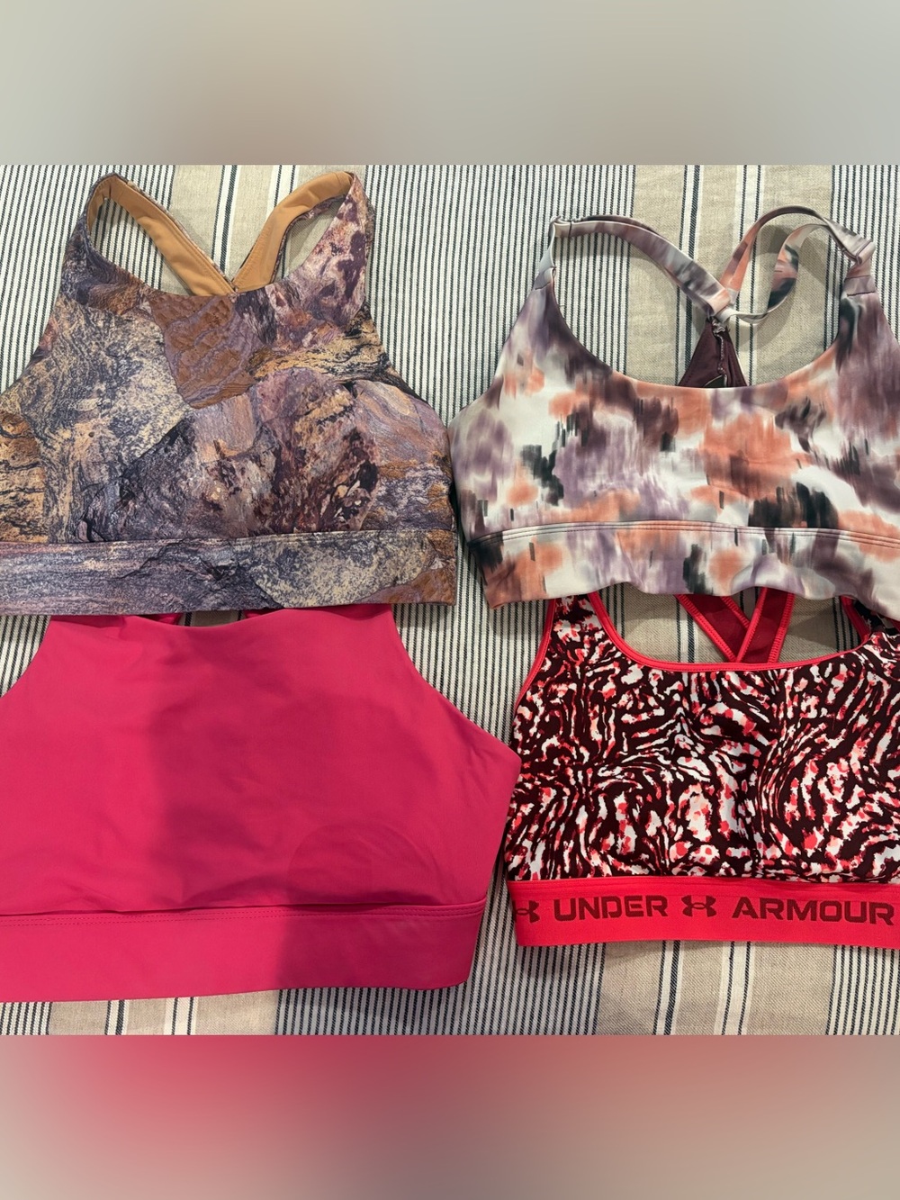 (4) barely worn womens sports bras size M- 2 Fabletics, 1 Athleta, 1 UA.